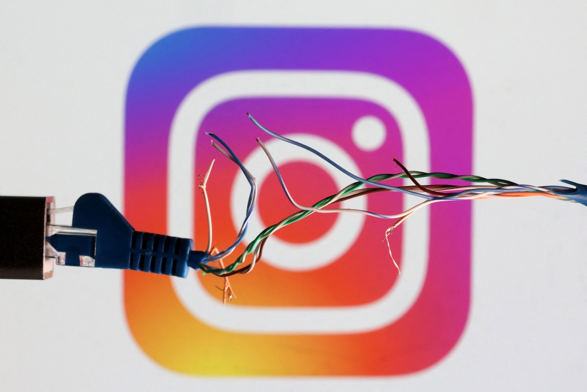 Broken Ethernet cable is seen in front of Instagram logo in this illustration taken on March 11, 2022.  File Photo / Reuters
