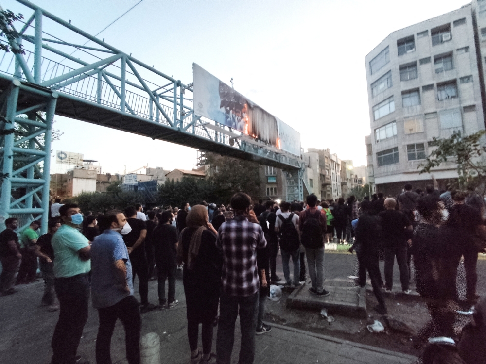 People attend a protest over the death of Mahsa Amini, a woman who died after being arrested by the Islamic republic's 
