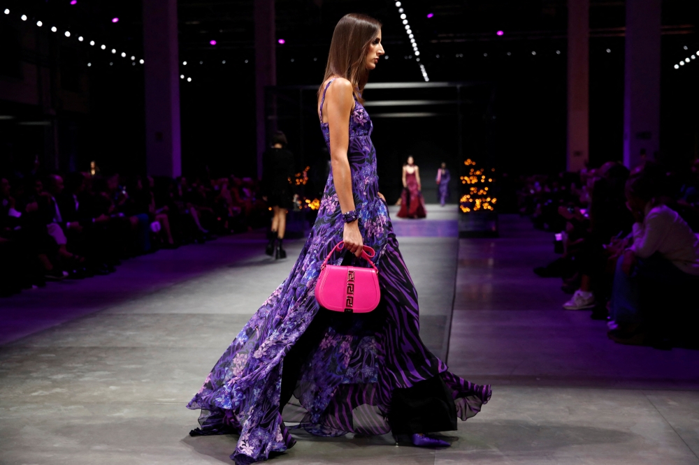 A model presents a creation from the Versace Spring/Summer 2023 collection during Milan Fashion Week in Milan, Italy, September 23, 2022. Reuters/Alessandro Garofalo
 