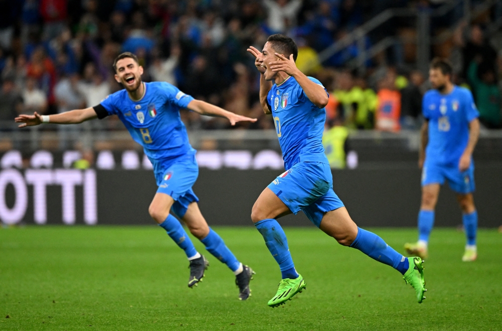 Italy's Giacomo Raspadori celebrates scoring their first goal with Jorginho REUTERS/Alberto Lingria
