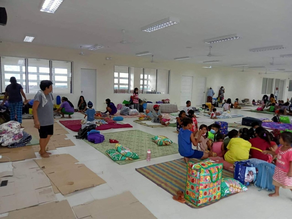 Residents are seen inside an evacuation centre in Aurora Province, Philippines, September 25, 2022 in this picture obtained from social media. Ricardo Balala Jr./via Reuters