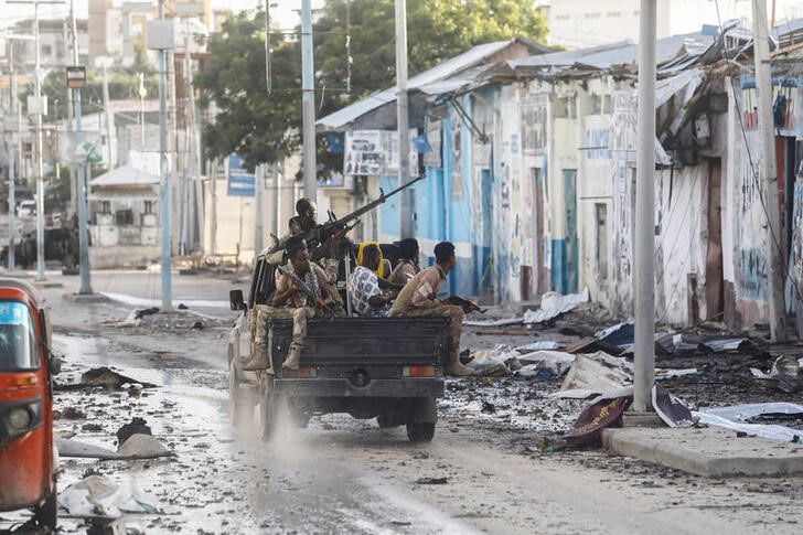 Somali security officers drive past a section of Hotel Hayat, the scene of an al Qaeda-linked al Shabaab group militant attack in Mogadishu, Somalia, on August 20, 2022. File Photo / Reuters
