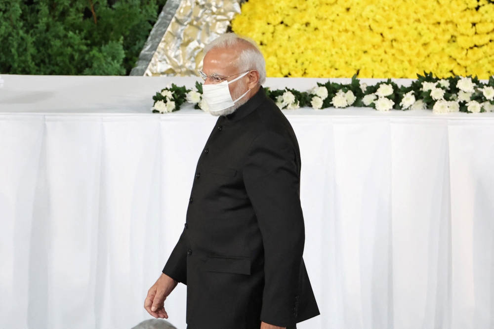 India's Prime Minister Narendra Modi pays respect during the state funeral for Japan's former prime minister Shinzo Abe at the Budokan in Tokyo, Japan, on September 27, 2022. Takashi Aoyama/Pool via REUTERS