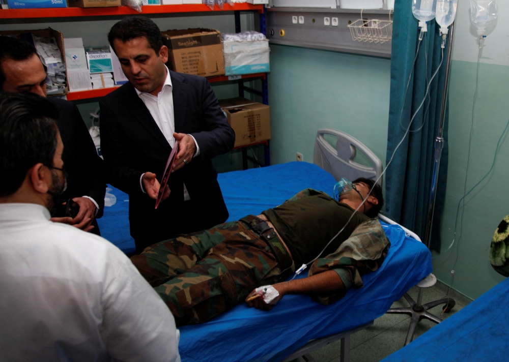A wounded man lies on a bed of a hospital after he was injured during Iran's Revolutionary Guards struck at militant targets in the Kurdish region of northern Iraq with missiles and drones, in Erbil, Iraq, on September 28, 2022. REUTERS/Azad Lashkari