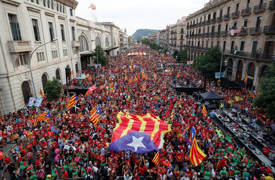 People hold up Esteladas (Catalan separatist flag) during the National Day Catalonia, called 'La Diada', in Barcelona, Spain, on September 11, 2021. File Photo / Reuters
