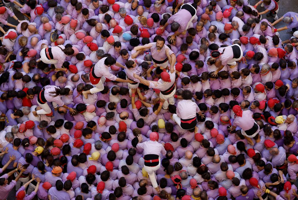 Colla Jove Xiquets de Tarragona start to form a human tower called 