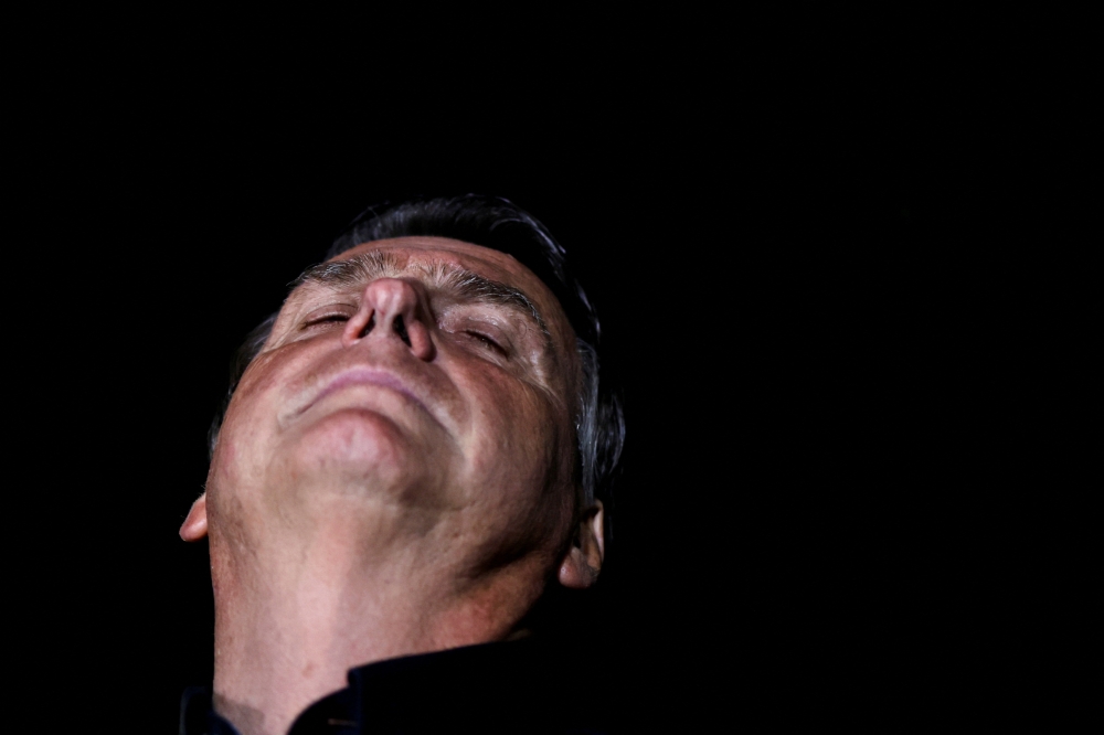 Brazil's President and presidential candidate Jair Bolsonaro speaks after the results of the first round of Brazil's presidential election, at the Alvorada Palace in Brasilia, Brazil October 2, 2022. Reuters/Ueslei Marcelino