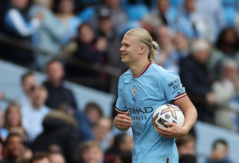 Manchester City's Erling Braut Haaland celebrates with the match ball after the match against Manchester United at the Etihad Stadium in Manchester on October 2, 2022.  Action Images via Reuters/Carl Recine