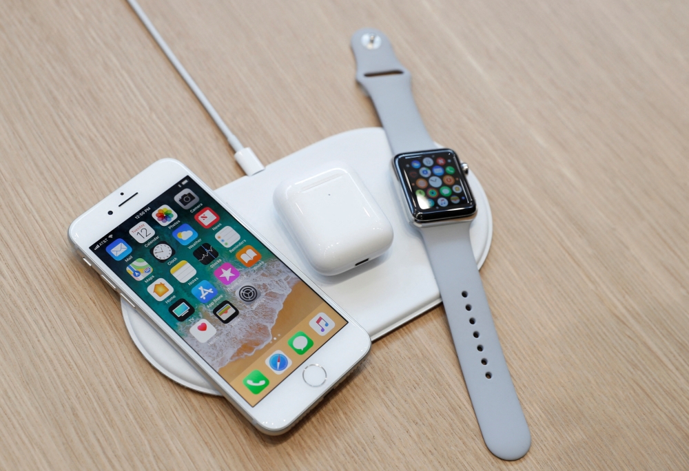 An AirPower wireless charger is displayed along with other products during an Apple launch event in Cupertino, California, U.S. September 12, 2017. REUTERS/Stephen Lam/File Photo
