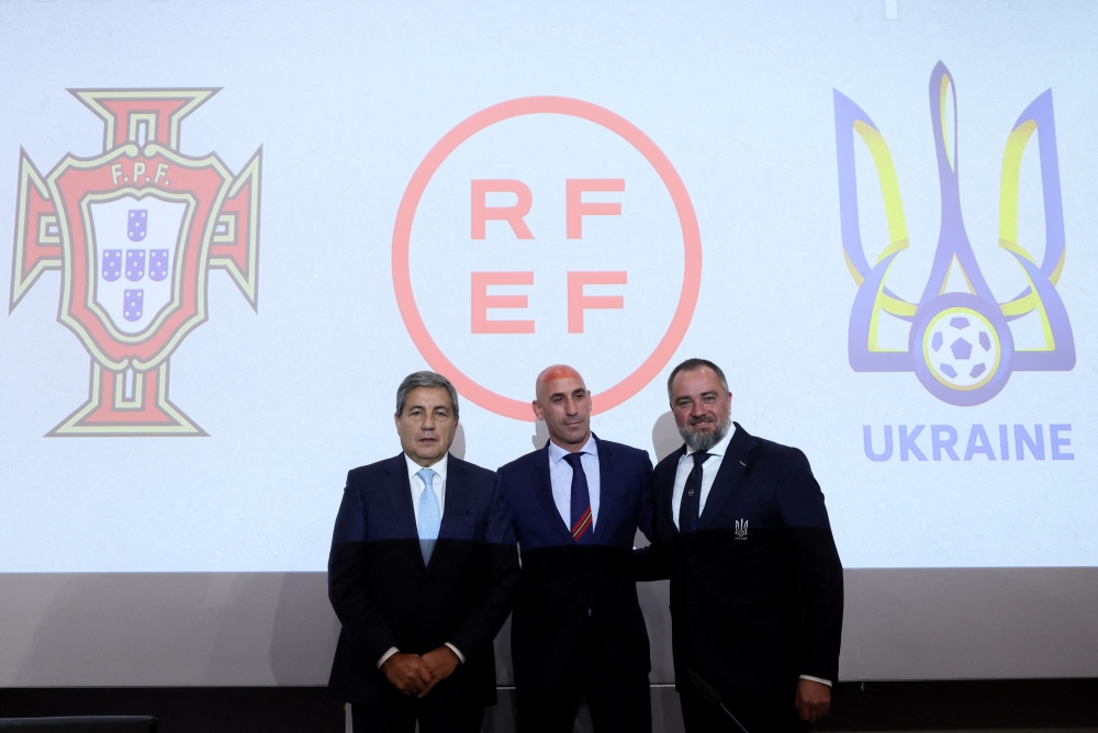 Portuguese Football Federation president Fernando Gomes, Spanish football Federation president Luis Rubiales and Ukrainian Association of Football president Andriy Pavelko pose during the press conference to announce their joint 2030 World Cup bid at the UEFA headquarters, Nyon, Switzerland, on October 5, 2022.  REUTERS/Denis Balibouse