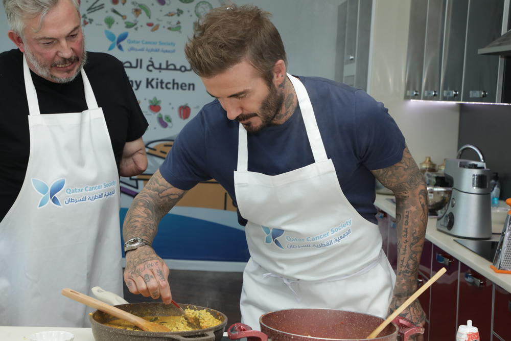 David Beckham (right) and Giles Duley during the QCS event.