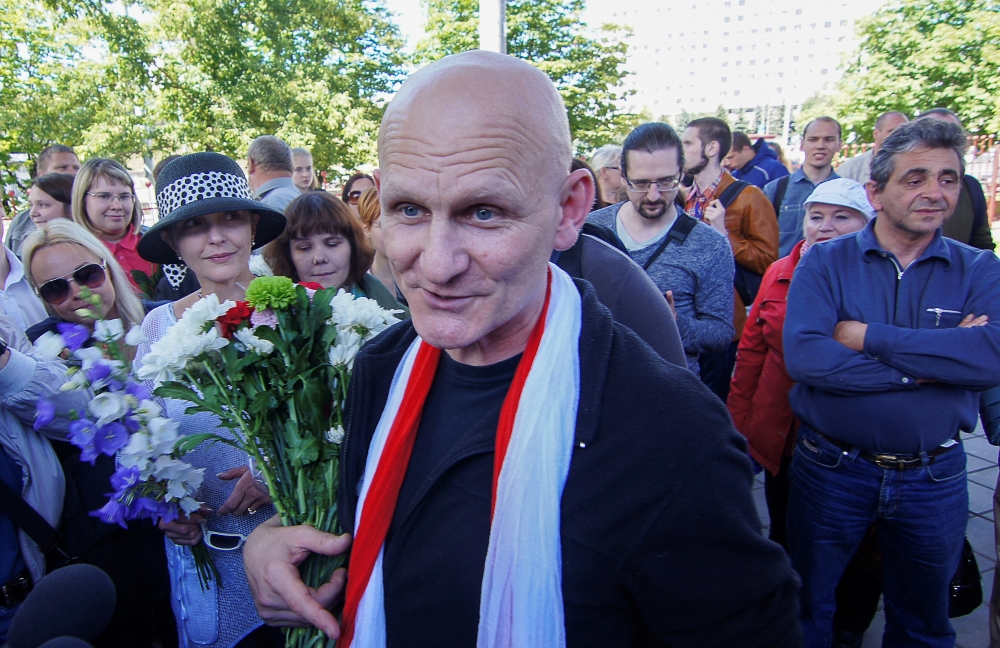 File Photo: Belarusian human rights activist Ales Byalyatski meets with journalists and his supporters, after he was released from prison and arrived at a railway station in Minsk, Belarus, June 21, 2014. (REUTERS/Marina Serebryakova)