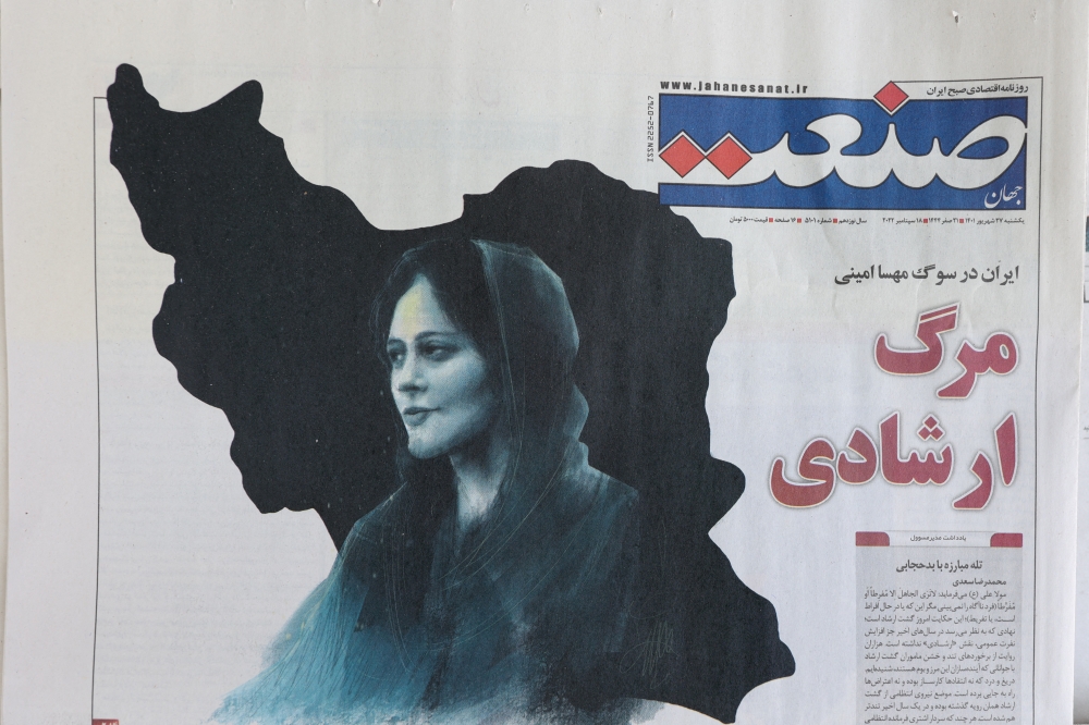 A newspaper with a cover picture of Mahsa Amini, a woman who died after being arrested by the Islamic republic's 