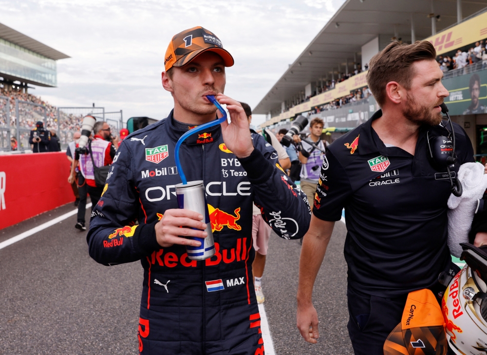 Red Bull's Max Verstappen has a drink after qualifying in pole position at the Japanese Grand Prix at Suzuka Circuit, Suzuka, Japan, on October 8, 2022. REUTERS/Issei Kato
 