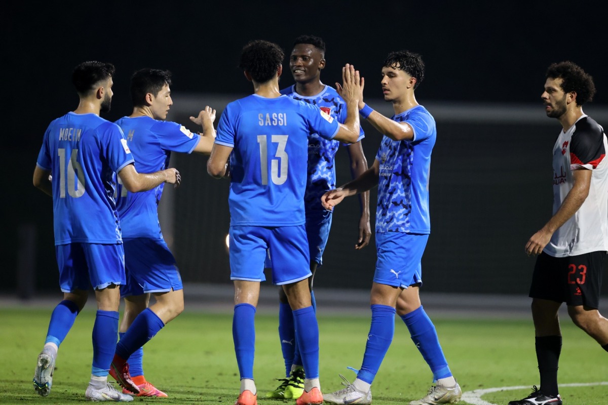 Al Duhail players celebrate after winning the match.
