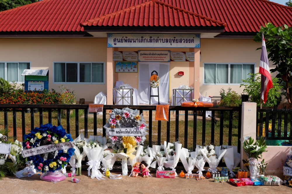 View of a makeshift memorial outside the day care centre which was the scene of a mass shooting in the town of Uthai Sawan, in the province of Nong Bua Lam Phu, Thailand, October 9, 2022. (REUTERS/Jorge Silva)