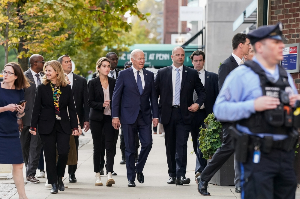 US President Joe Biden, his granddaughter Natalie Biden and University of Pennsylvania President Elizabeth Magill walk into the Penn Bookstore at the University of Pennsylvania in Philadelphia, Pennsylvania, US, on October 7, 2022. REUTERS/Elizabeth Frantz