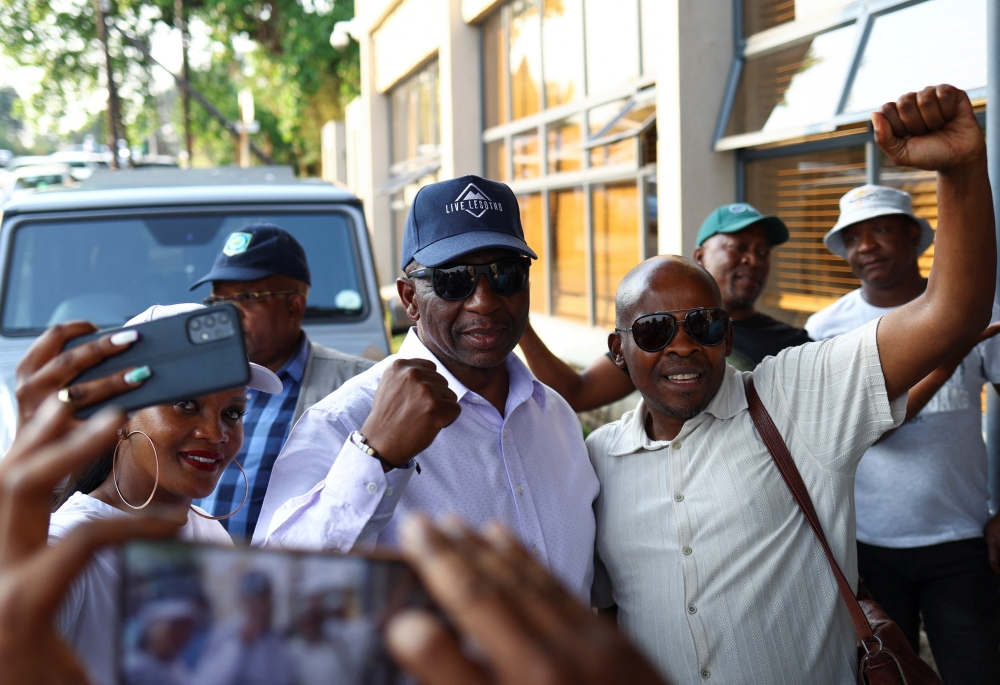 Sam Matekane, a millionaire diamond magnate and leader of Lesotho's Revolution For Prosperity (RFP), gestures before addressing his supporters following the Lesotho's parliamentary election in the capital Maseru, Lesotho, on October 8, 2022. REUTERS/Siphiwe Sibeko