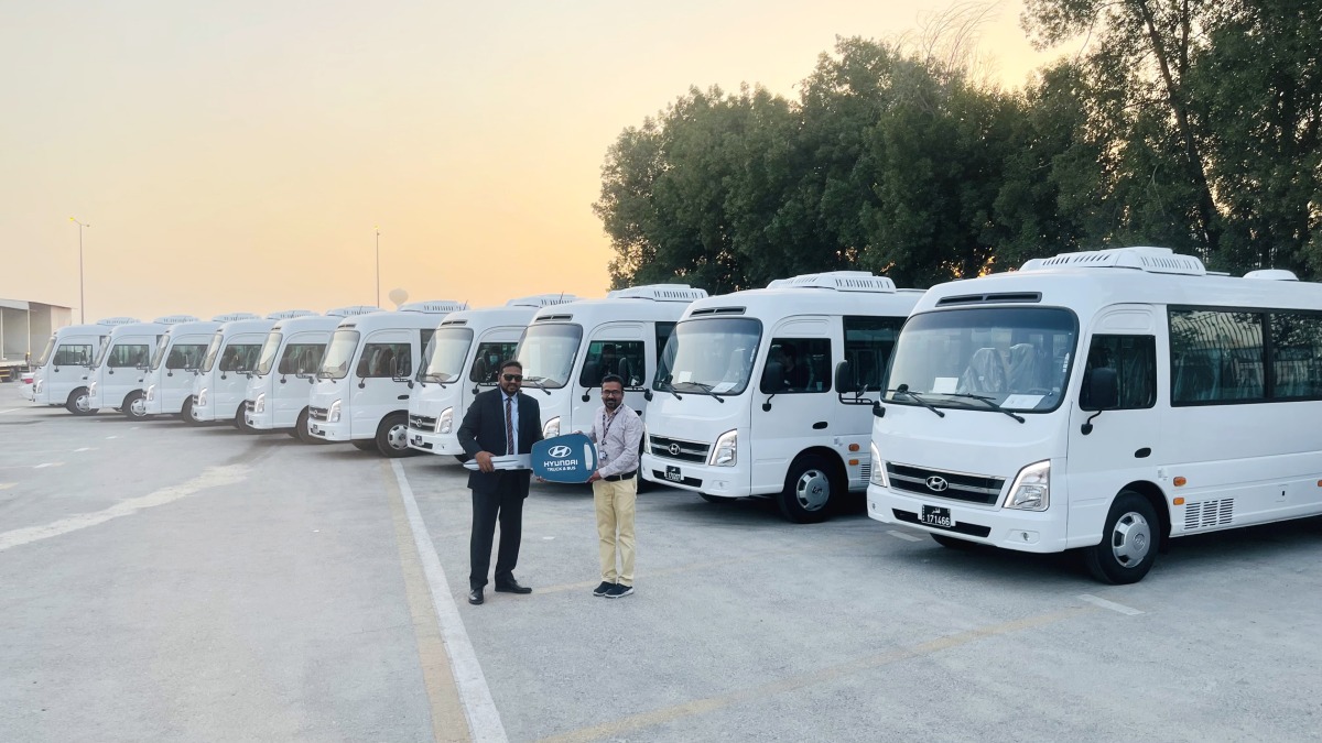 An official presents the key during the delivery of a large fleet of the County Bus in Doha, recently. 