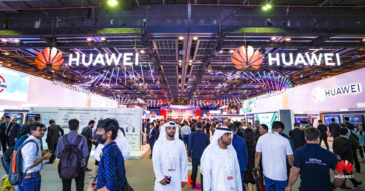 Visitors walk in front of the Huawei pavilion at GITEX GLOBAL 2022. 