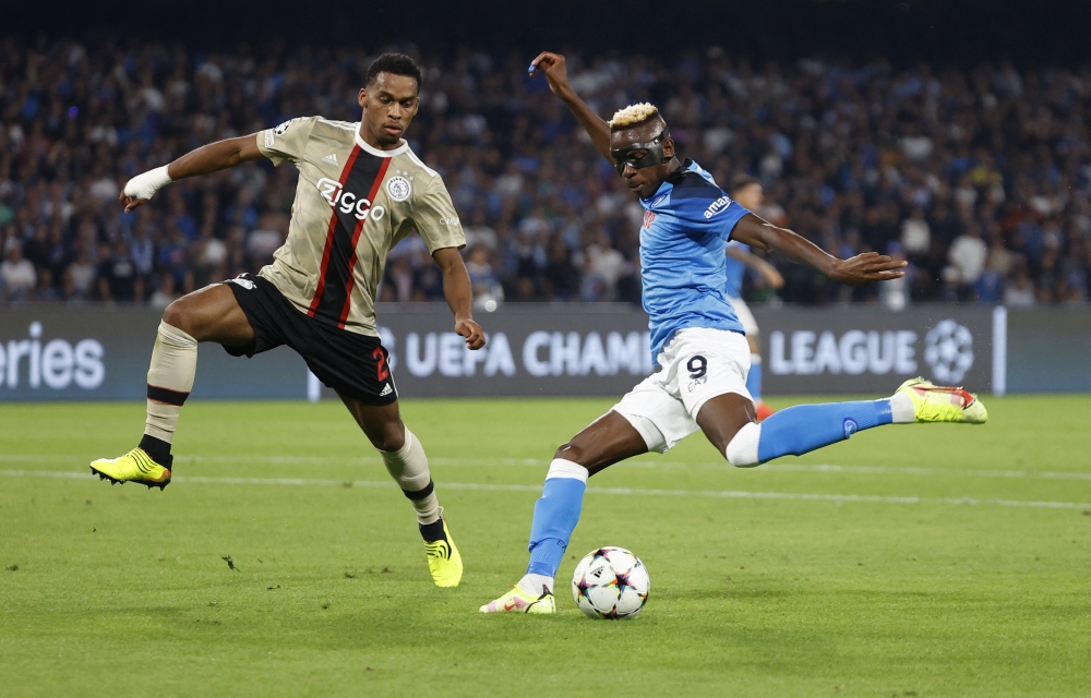 Napoli's Victor Osimhen in action against Ajax Amsterdam's Jurrien Timber during their UEFA Champions League Group A  match at the Stadio Diego Armando Maradona, in Naples, Italy, on October 12, 2022.  REUTERS/Ciro De Luca