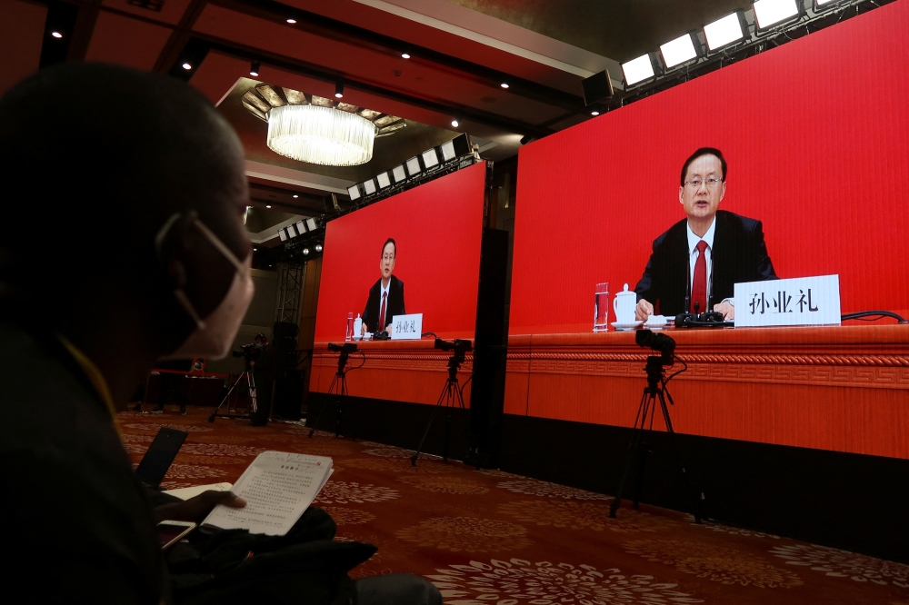 Spokesperson Sun Yeli speaks via video link at a news conference ahead of the 20th National Congress of the Communist Party of China, in Beijing, China, on October 15, 2022. REUTERS/Shubing Wang