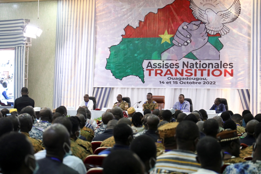 People attend the beginning of the two days of national talks to adopt a transitional charter and designate an interim president to lead the country will take place, in Ouagadougou, Burkina Faso, on October 14, 2022. REUTERS/Vincent Bado