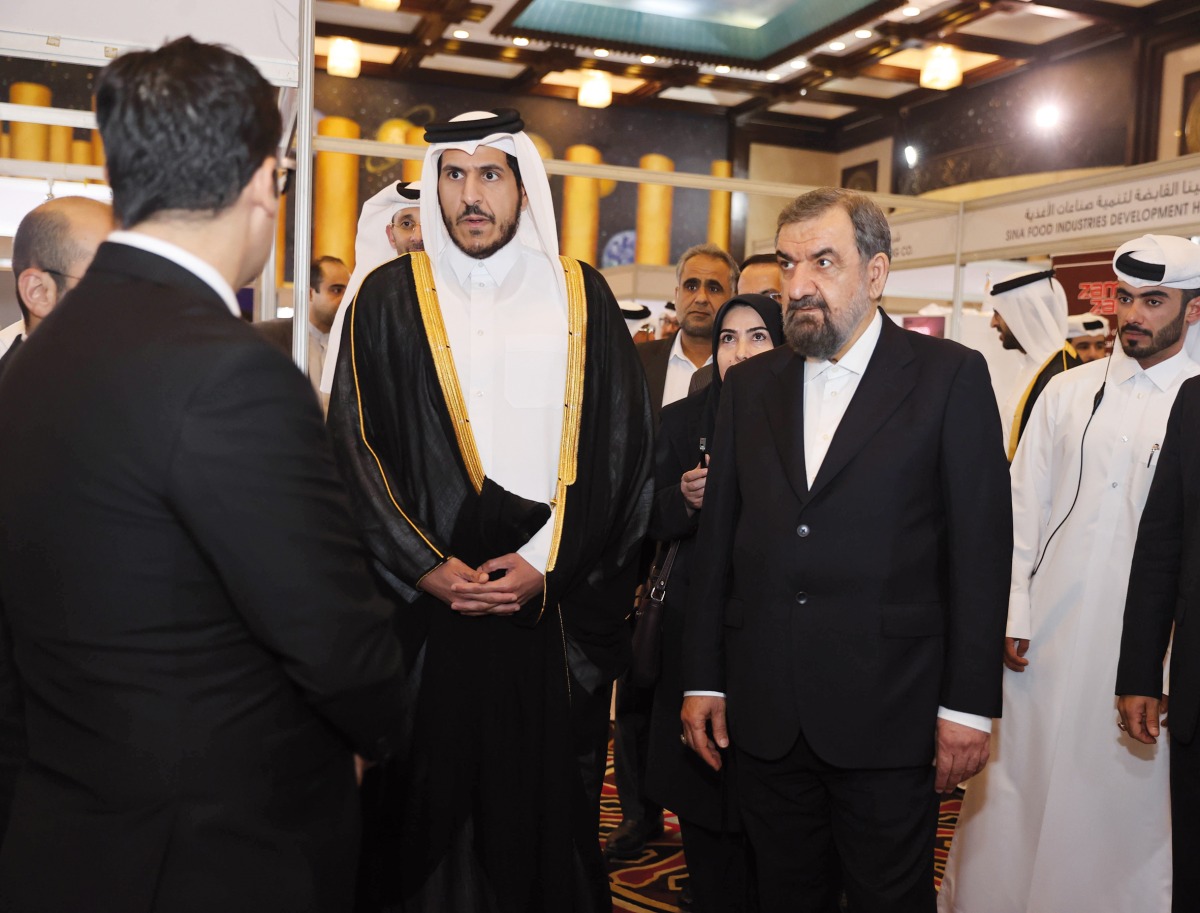 Minister of Commerce and Industry H E Sheikh Mohammed bin Hamad bin Qassim Al Thani and Vice President for Economic Affairs of the Islamic Republic of Iran H E Mohsen Rezaei during the inauguration of QI International Trade Fair for Iranian Products.