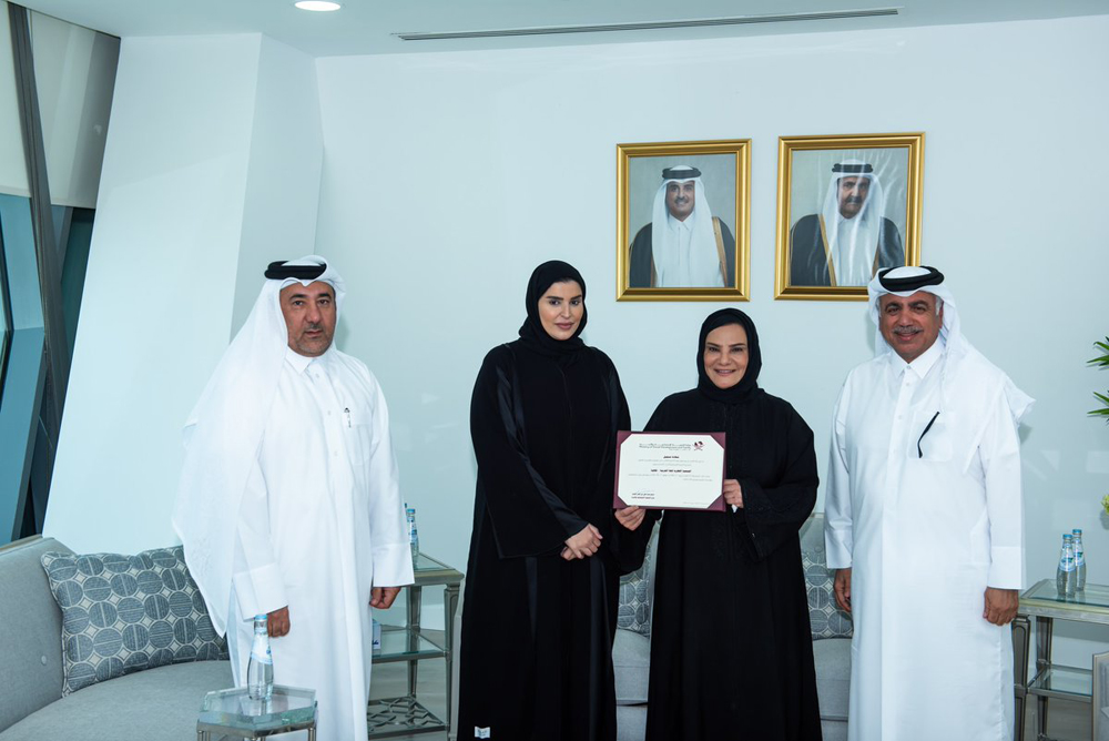 Minister of Social Development and Family H E Mariam bint Ali bin Nasser Al Misnad (second left) handing over the certificate of registration of the association to Dr. Maryam Abdul Rahman Al Nuaimi and Abdul Aziz Abdul Rahim Al Sayed. 