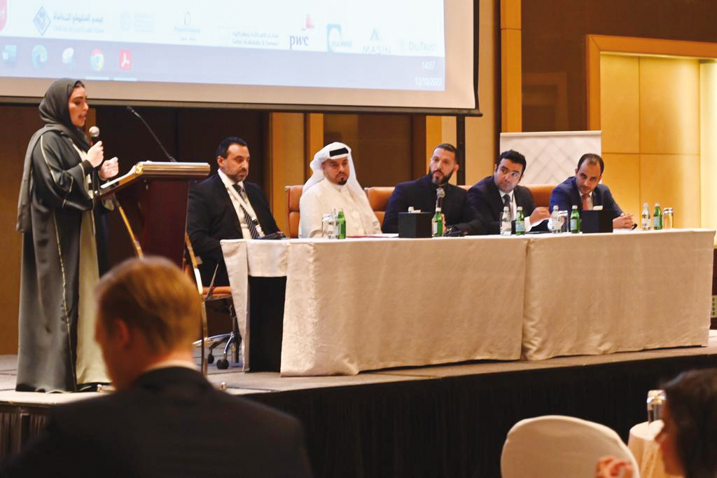 Director of Legal Affairs at MoCI Hilal Al Khulaifi (second left) with other panellists during the 7th Qatar Business Law Forum Conference 2022. 