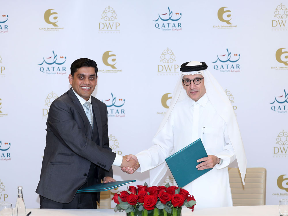 Chairman of Qatar Tourism and Qatar Airways Group Chief Executive H E Akbar Al Baker (right) and  Director of QnA International Ackash Jain after signing the agreement.