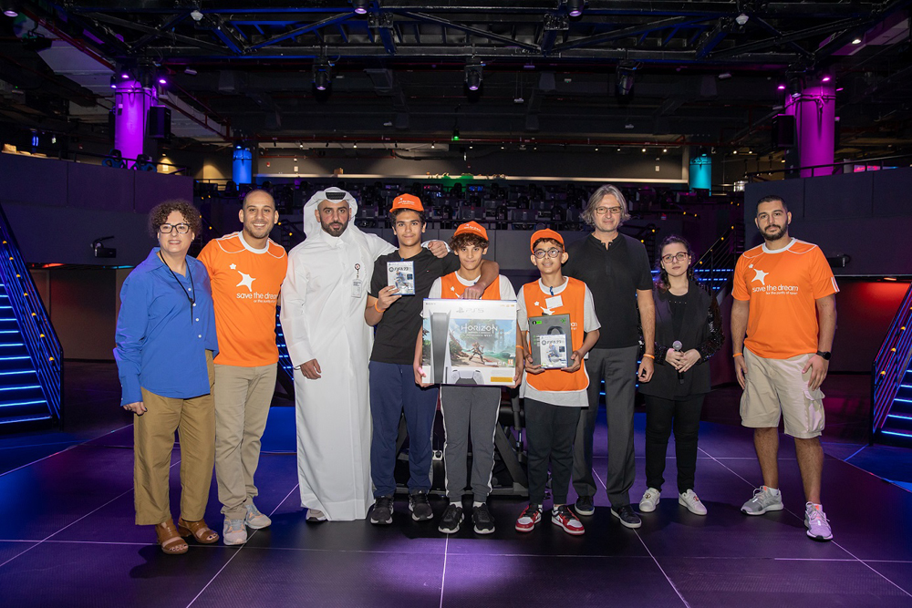 Officials with participants of eSports tournament. 