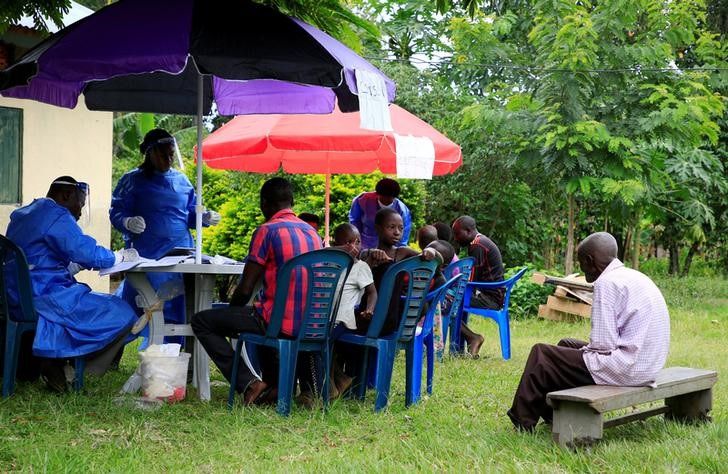 Ugandan health workers speak to members of the community before carrying out the first vaccination exercise against the ebola virus in Kirembo village, near the border with the Democratic Republic of Congo in Kasese district, Uganda, on June 16, 2019.  File Photo / Reuters