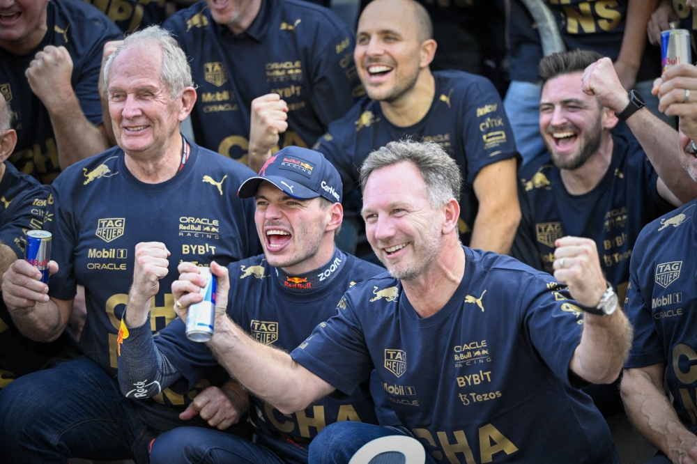 Red Bull racing advisor Helmut Marko (left) and Red Bull driver Max Verstappen (centre) and Team Principal Christian Horner celebrate winning the US Grand Prix F1 race and Constructors Championship at Circuit of the Americas in Austin, Texas, USA, on October 23, 2022.  Mandatory Credit: Jerome Miron-USA TODAY Sports
 