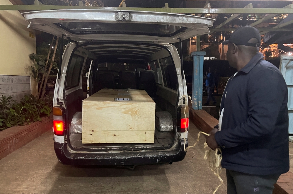 The wooden coffin containing the body of Pakistani journalist Arshad Sharif, who was shot dead when police hunting car thieves opened fire on the vehicle he was traveling in as it drove through their roadblock without stopping, is loaded into a courtesy van at the Chiromo mortuary in Nairobi, Kenya, on October 24, 2022. REUTERS/Thomas Mukoya