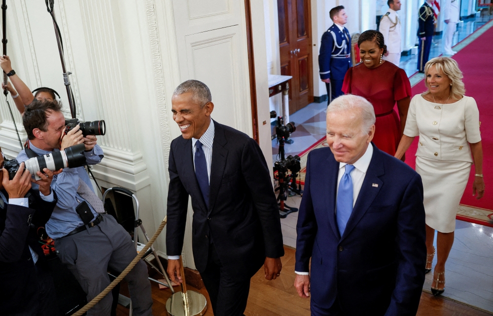 US President Joe Biden and first lady Jill Biden host former US President Barack Obama and former first lady Michelle Obama for the unveiling of their official White House portraits, painted by Robert McCurdy and Sharon Sprung, respectively, in the East Room of the White House, in Washington, US, on September, 7, 2022. File Photo / Reuters