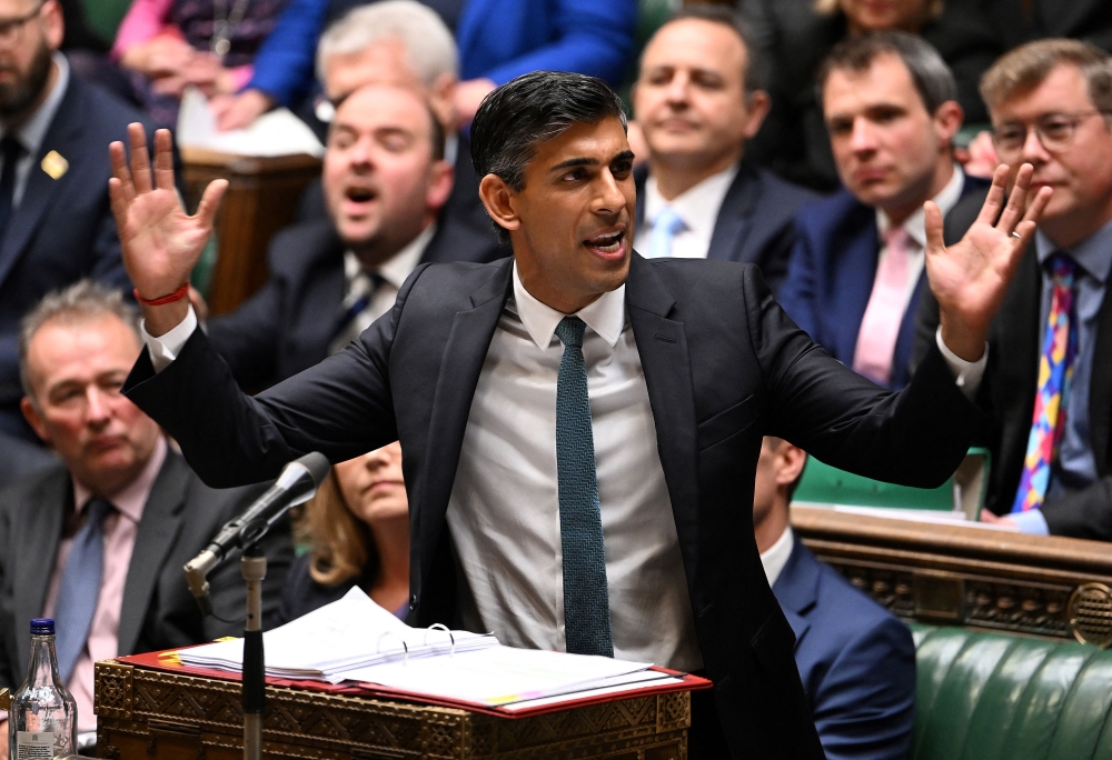 A handout photograph released by the UK Parliament shows Britain's Prime Minister Rishi Sunak speaking during his first Prime Minister's Questions (PMQs) in the House of Commons in London on October 26, 2022. AFP PHOTO / Jessica Taylor /UK Parliament