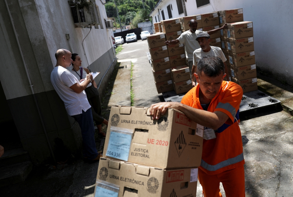 Workers prepare electronic ballot boxes for transport to voting stations ahead of the second round of Brazil's presidential election, in Rio de Janeiro, Brazil, on October 29, 2022. REUTERS/Ricardo Moraes