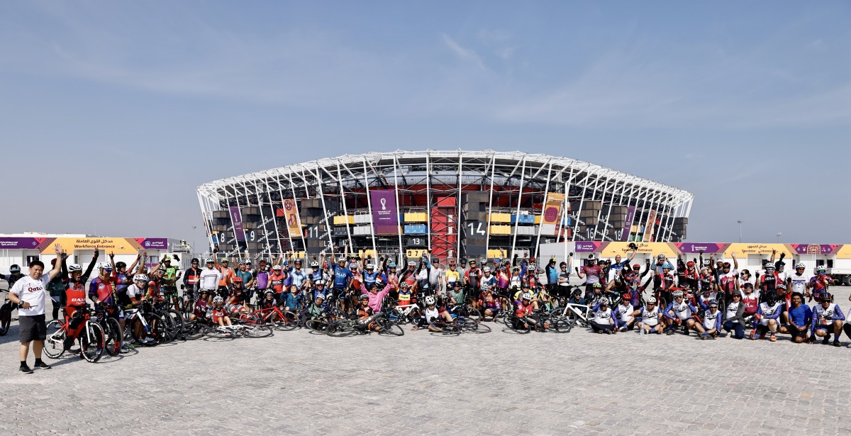 Participants pose for a group photo at Stadium 974.
