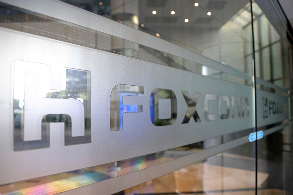 A sign of Foxconn is seen at a glass door inside its office building in Taipei, Taiwan November 12, 2020. REUTERS/Ann Wang/File Photo