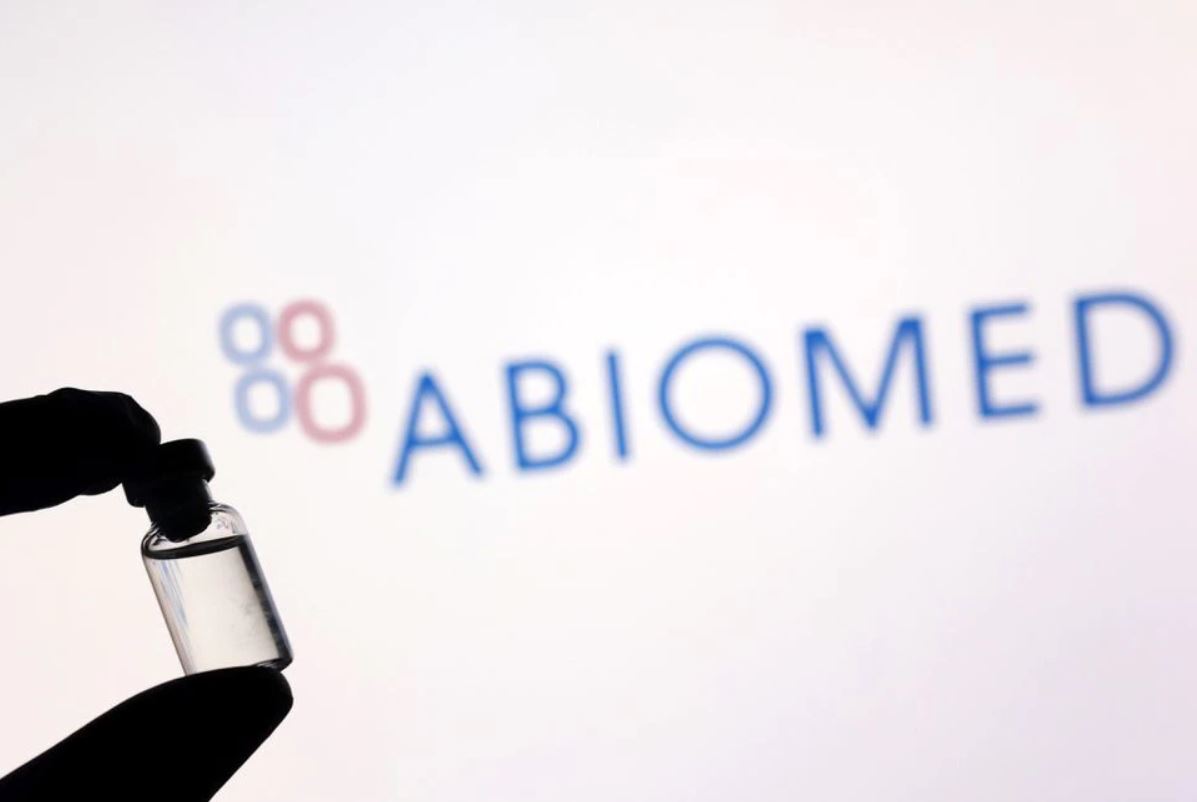 A vial is seen in front of displayed Abiomed logo in this illustration taken December 1, 2021. (REUTERS/Dado Ruvic)

