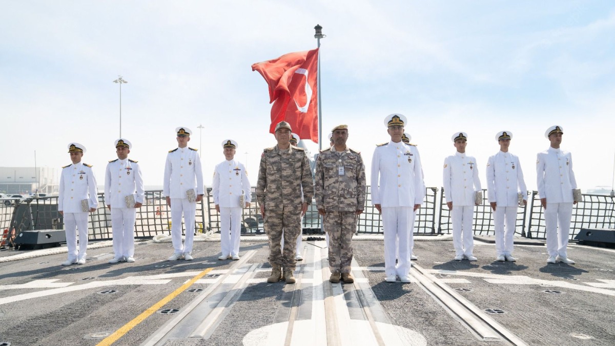 Qatari and Turkish officials on the deck of F-513 Burgazada at Umm Al Houl Naval Base.