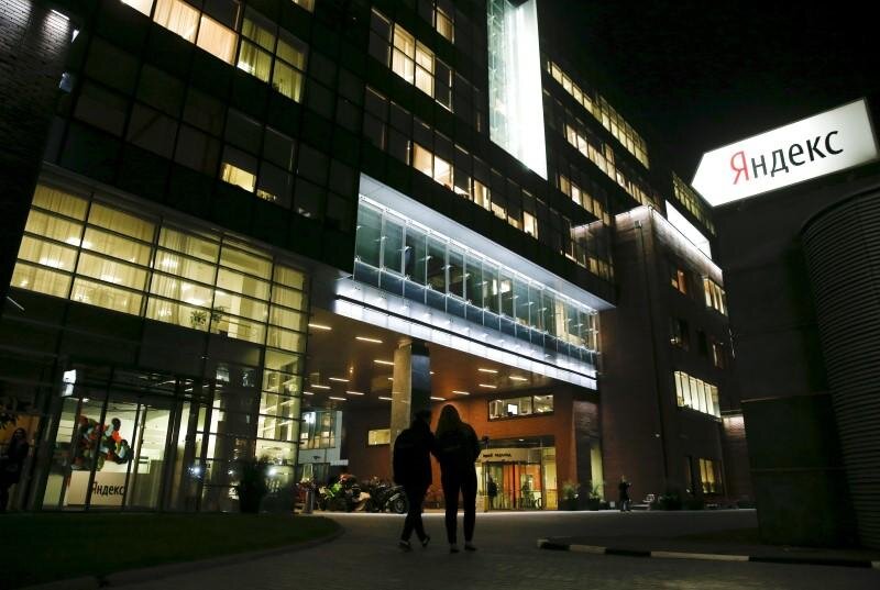 People walk outside the headquarters of Yandex company in Moscow, on September 14, 2015. File Photo / Reuters