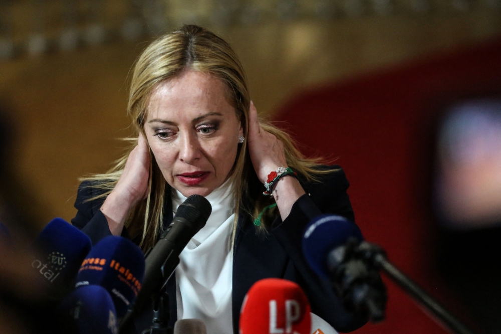 Newly appointed Italian Prime Minister Giorgia Meloni speaks to the press following a meeting at the European Council headquarters in Brussels on November 3, 2022. (AFP/Valeria Mongelli)