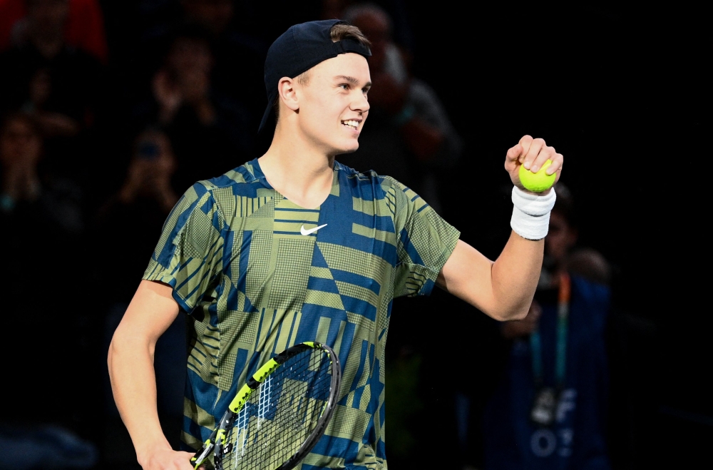 Denmark's Holger Rune celebrates after winning against Canada's Felix Auger-Aliassime at the end of their men's singles semi-final tennis match on day 6 of the ATP World Tour Masters 1000 - Paris Masters (Paris Bercy) - indoor tennis tournament at The AccorHotels Arena in Paris on November 5, 2022. (Photo by Christophe ARCHAMBAULT / AFP)