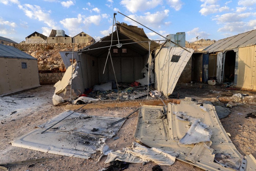 This picture shows the damage caused by reported regime shelling on the camp of Maram for internally displaced people near the village of Kafr Jales in Syria's northwestern Idlib province, on November 6, 2022, that killed at least 6 people including children. (Photo by Abdulaziz KETAZ / AFP)