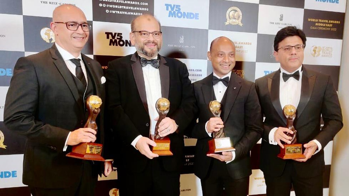 Tawfeeq Travel Group officials with the awards.