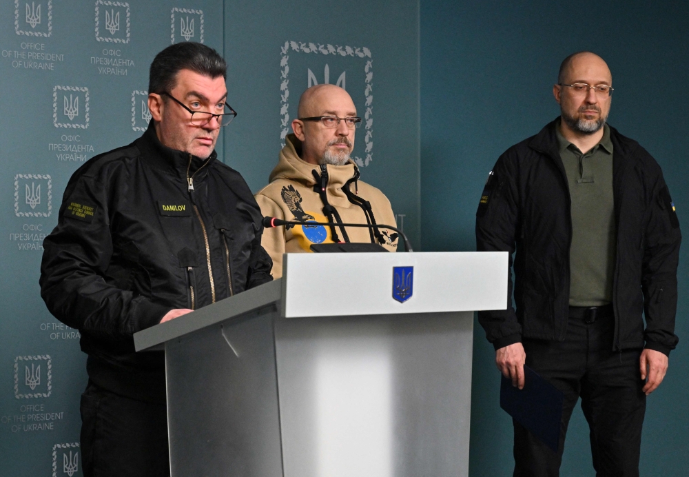 (From left to right) Secretary of the National Security and Defence Council of Ukraine Oleksiy Danilov, Ukrainian Minister of Defence Oleksii Reznikov and the Ukrainian Prime Minister Denys Shmyhal hold a press conference in Kyiv on November 7, 2022.  (Photo by Sergei SUPINSKY / AFP)