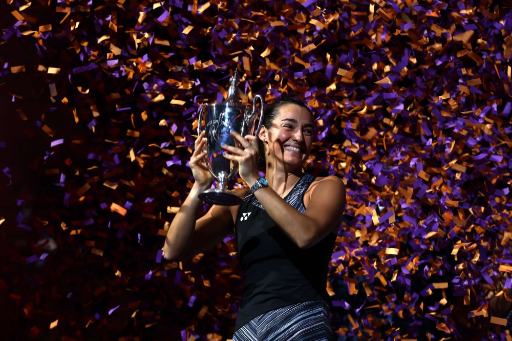 Caroline Garcia of France celebrates with the Billie Jean King Trophy after defeating Aryna Sabalenka of Belarus in their Women's Singles Final match during the 2022 WTA Finals, part of the Hologic WTA Tour, at Dickies Arena on November 07, 2022 in Fort Worth, Texas. Katelyn Mulcahy/Getty Images/AFP