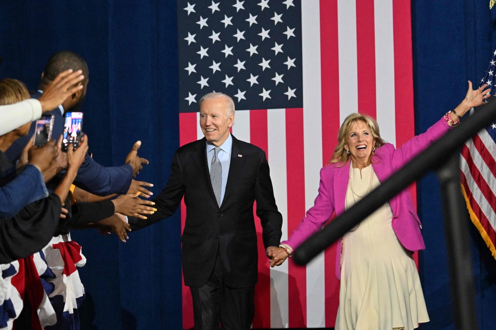 US President Joe Biden and First Lady Jill Biden arrive for a rally for gubernatorial candidate Wes Moore and the Democratic Party on the eve of the US midterm elections, at Bowie State University in Bowie, Maryland, on November 7, 2022. (Photo by Mandel NGAN / AFP)